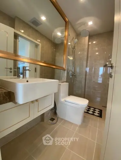 Luxurious modern bathroom with elegant fixtures and large mirror