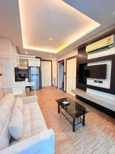 Modern living room with stylish ceiling lights and sleek furniture