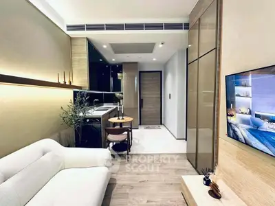 Modern living room with sleek design, cozy sofa, and stylish dining area in a contemporary apartment.