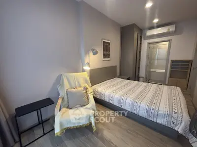 Modern bedroom with cozy decor and stylish furnishings in a contemporary apartment.
