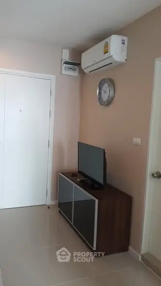 Modern living room with air conditioning and sleek TV setup