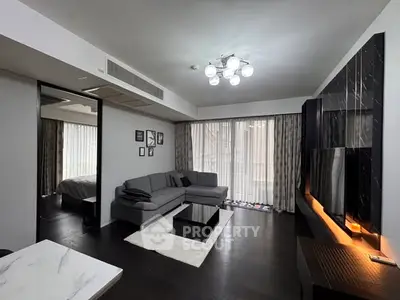 Modern living room with sleek design and large windows for natural light