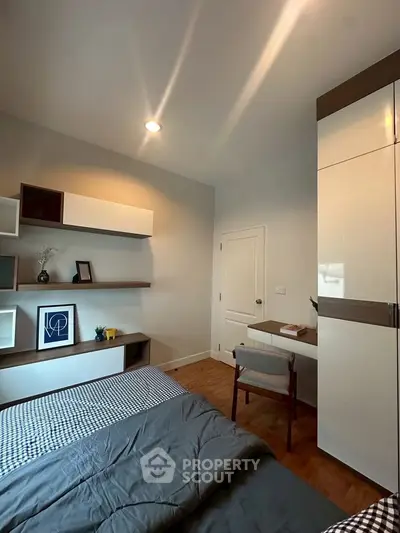 Cozy bedroom with modern decor and built-in storage solutions