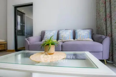 Charming living room with cozy sofa and stylish decor