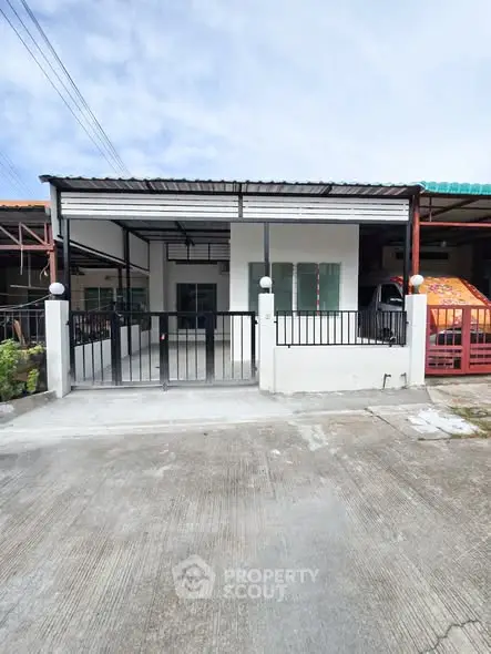 Charming single-story home with covered carport and modern exterior design.