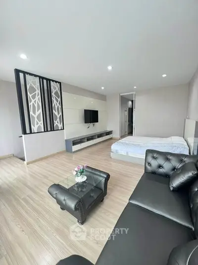 Spacious modern living room with sleek furniture and elegant decor