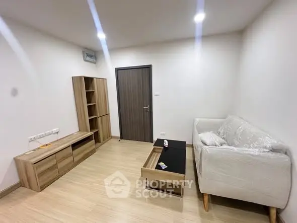 Modern living room with wooden furniture and cozy white sofa