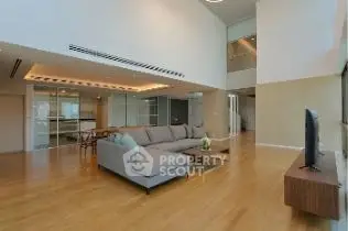Spacious modern living room with high ceilings and elegant decor