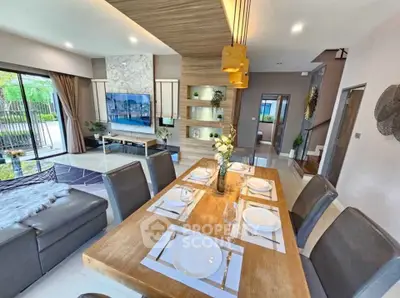 Modern open-plan living and dining area with stylish decor and natural light.