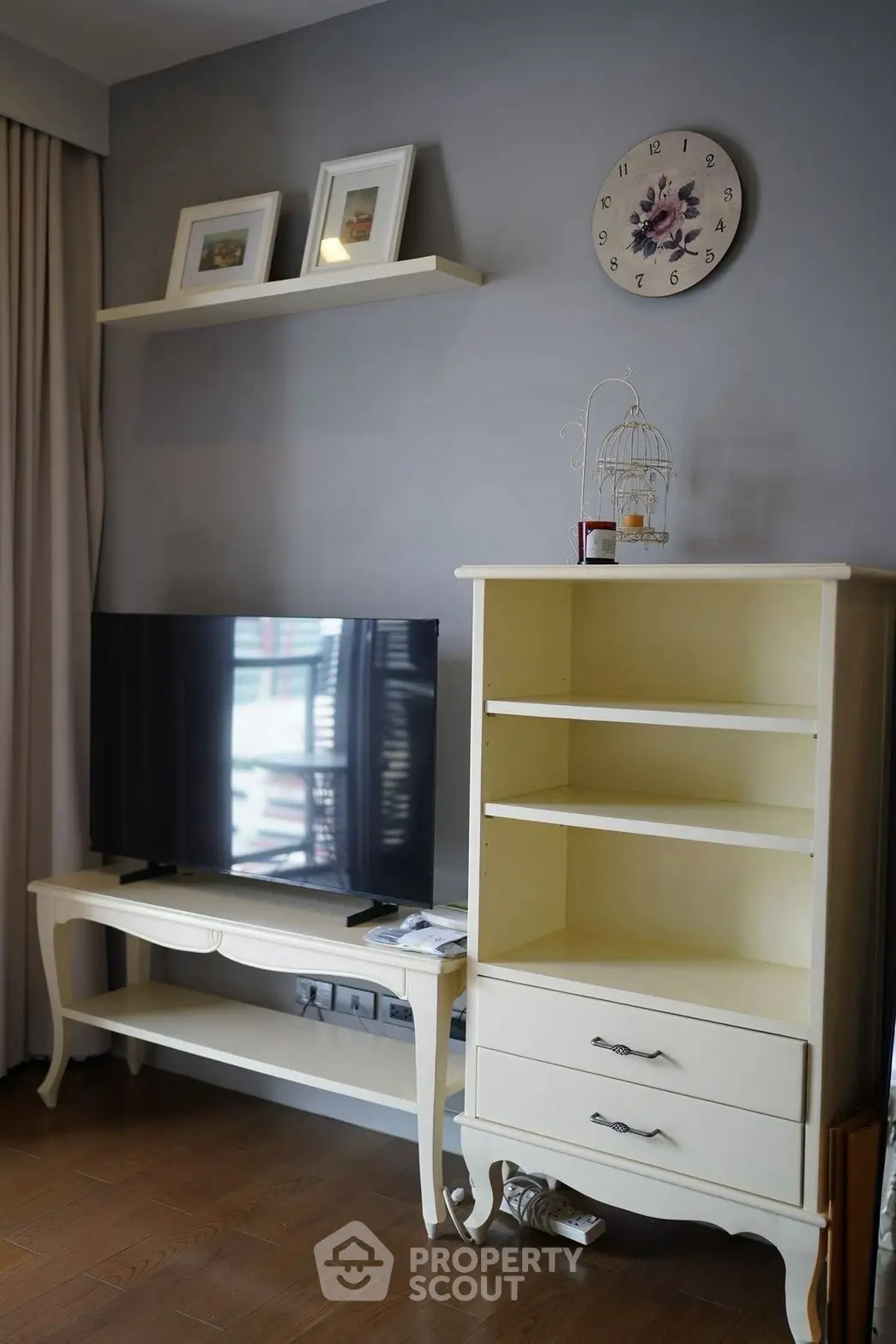 Charming living room with elegant furniture and wall decor, perfect for cozy relaxation.