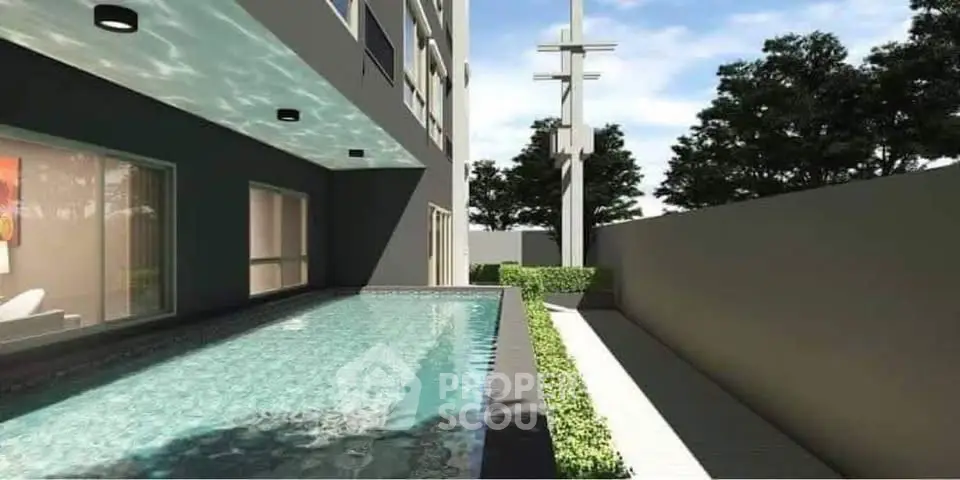 Modern residential building with sleek swimming pool and lush greenery, perfect for luxury living.