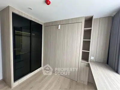 Modern study room with sleek wooden cabinetry and built-in desk