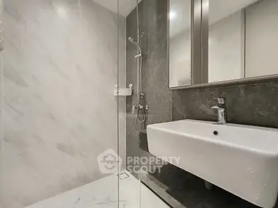 Modern bathroom with sleek design and elegant fixtures in luxury real estate property.