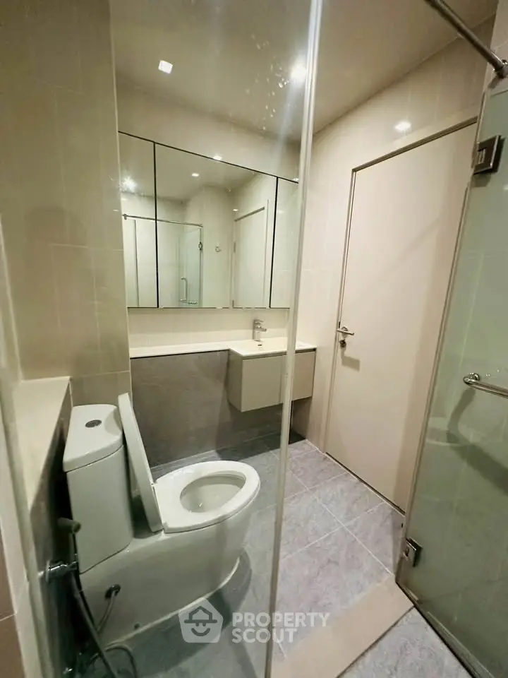 Modern bathroom with sleek design and glass shower enclosure