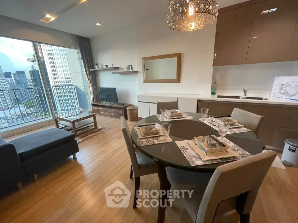Modern living room with dining area and city view balcony in luxury apartment.
