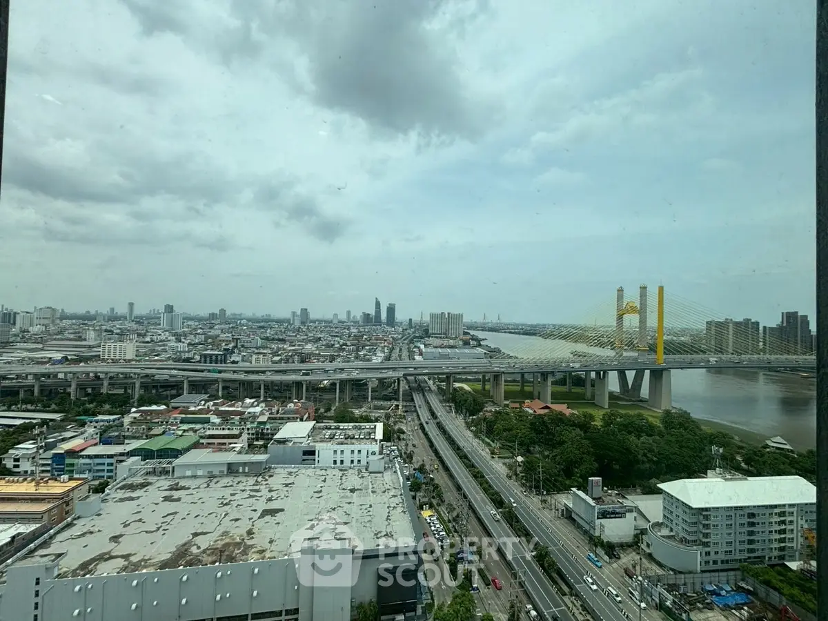Stunning cityscape view featuring a prominent bridge and urban skyline, ideal for real estate marketing.