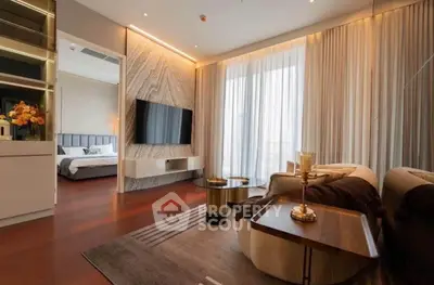 Luxurious modern living room with elegant decor and view into a stylish bedroom