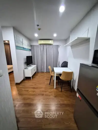 Modern apartment interior with wooden flooring and cozy dining area