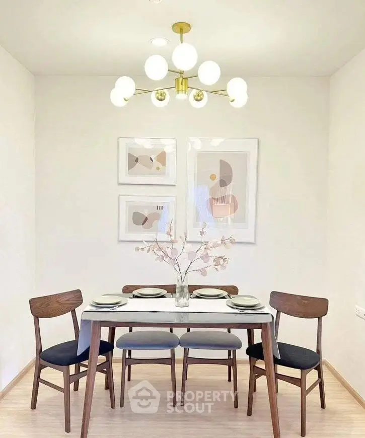 Stylish dining area with modern chandelier and elegant decor, perfect for intimate gatherings.