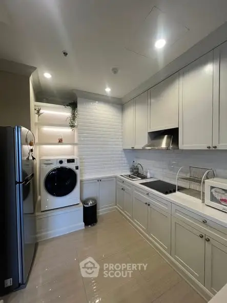 Modern kitchen with sleek cabinetry and integrated appliances