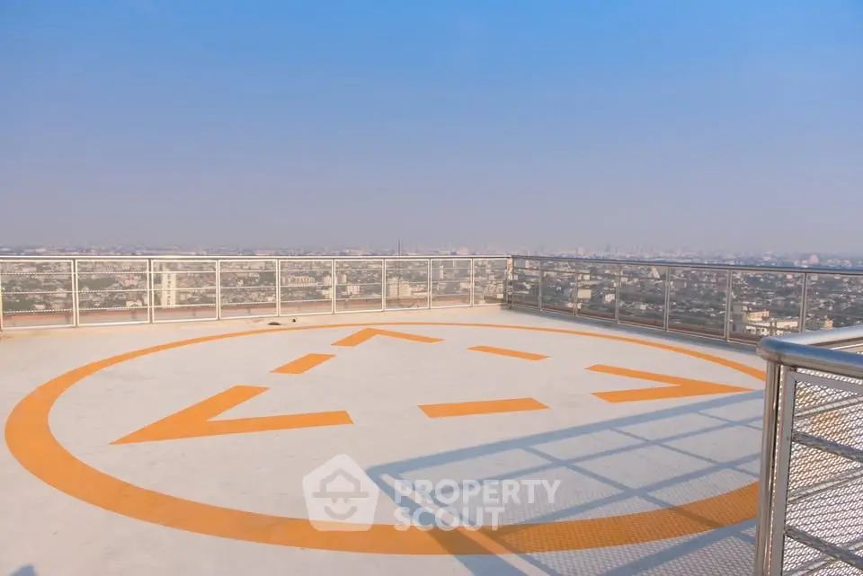 Stunning rooftop helipad with panoramic city views, perfect for luxury urban living.