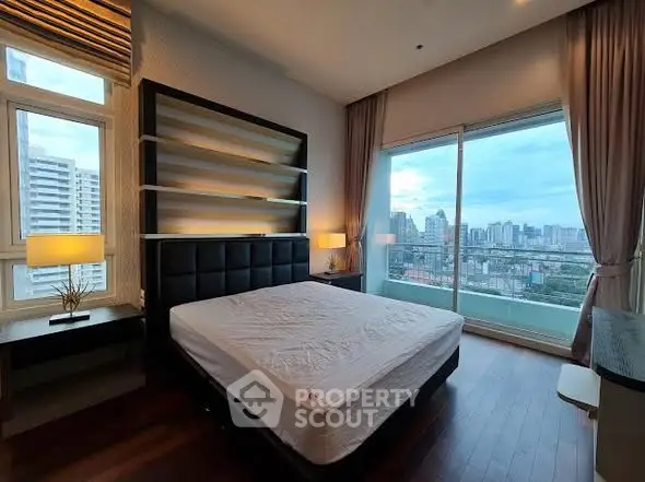 Luxurious bedroom with city view and modern furnishings