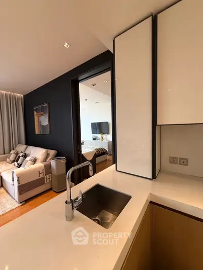 Modern open-plan kitchen with sleek design and cozy living area