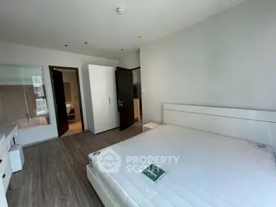 Spacious modern bedroom with sleek design and natural light