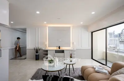 Elegant living room with modern decor and city view balcony