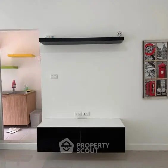 Modern minimalist interior with sleek shelving and wall art