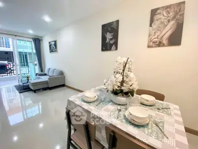 Modern living room with elegant dining area and stylish decor