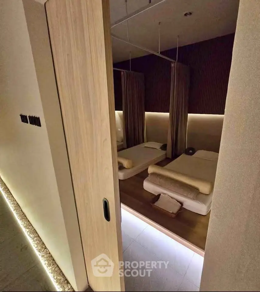 Luxurious spa-like bedroom with ambient lighting and minimalist design