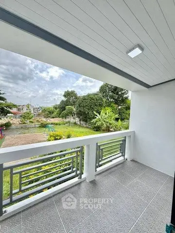 Spacious balcony with scenic garden view in modern home