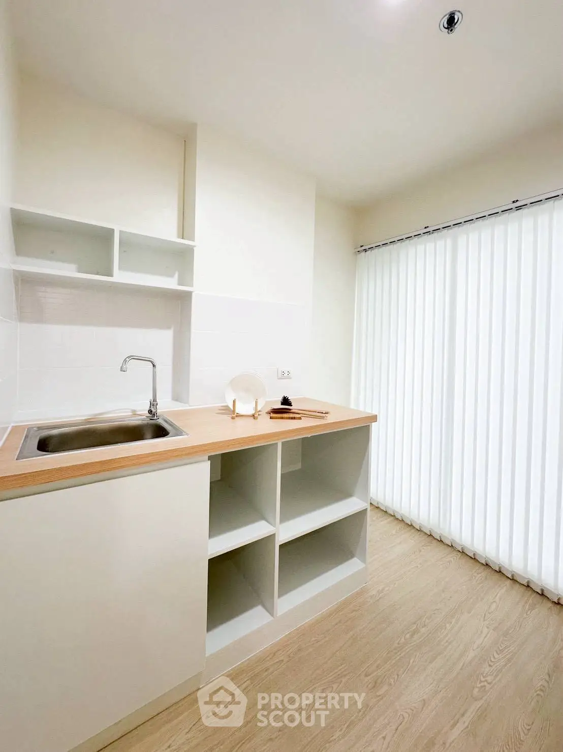 Modern minimalist kitchen with open shelving and sleek design
