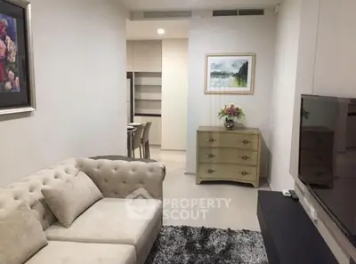 Elegant living room with plush sofa and modern decor in a stylish apartment.