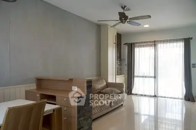 Spacious living room with modern decor and natural light