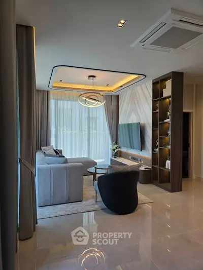 Luxurious modern living room with elegant decor and large windows for natural light.