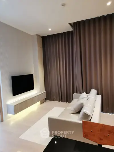 Modern living room with sleek design and elegant curtains