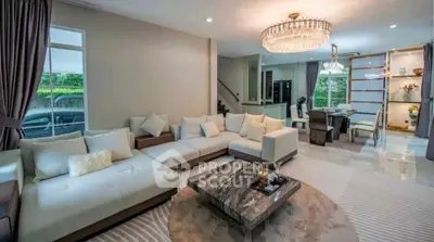 Luxurious living room with elegant chandelier and spacious seating area