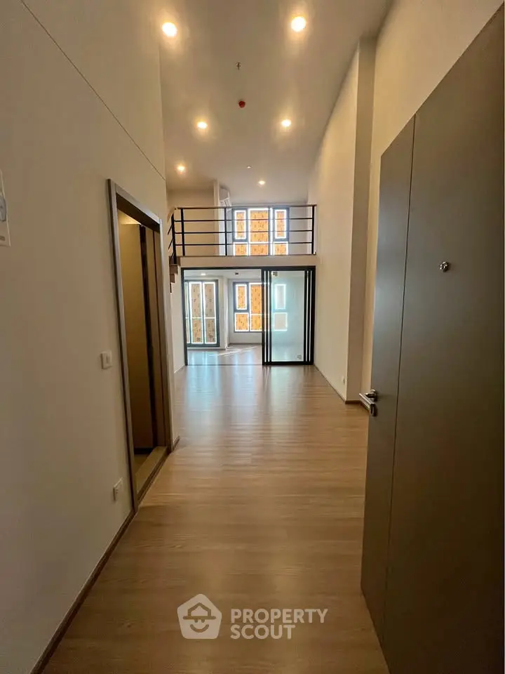 Spacious modern loft with high ceilings and large windows, perfect for urban living.