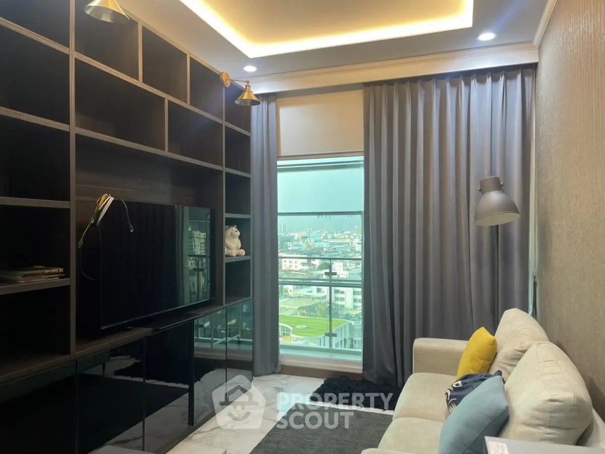 Modern living room with city view, sleek shelving, and cozy seating area.