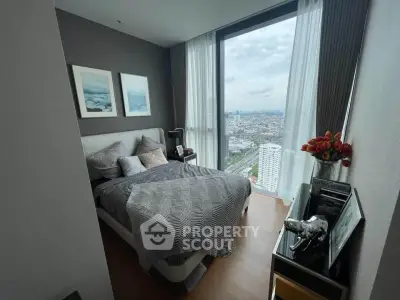 Modern bedroom with stunning city view and stylish decor