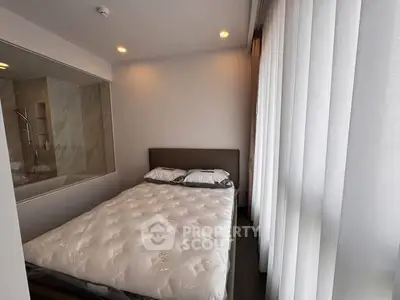 Cozy bedroom with large window and modern decor