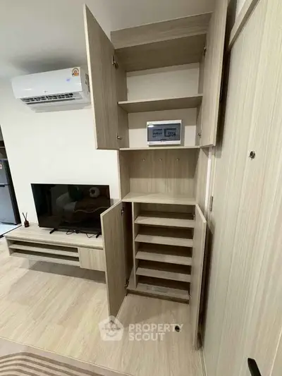 Modern living room with built-in storage and sleek entertainment unit