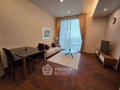 Modern living room with elegant decor and large window view