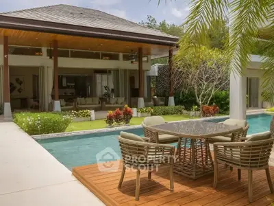 Luxurious villa with private pool and elegant outdoor seating area, perfect for relaxation and entertainment.