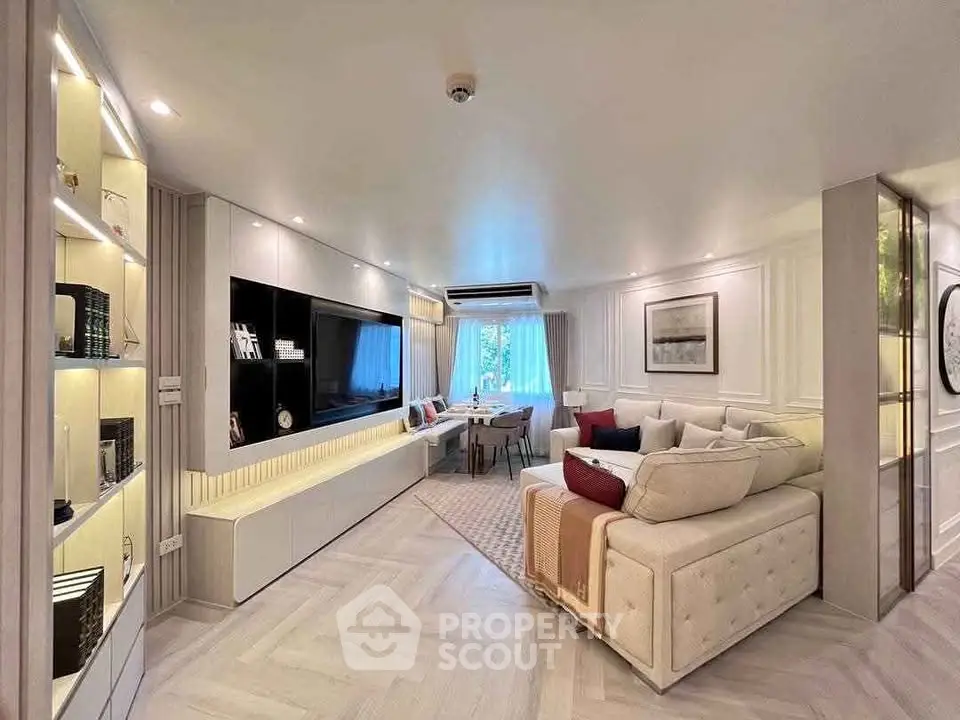 Luxurious modern living room with elegant decor and cozy seating area.