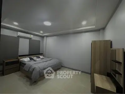 Spacious modern bedroom with minimalist design and cozy ambiance