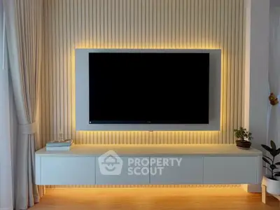 Modern living room with stylish TV setup and ambient lighting