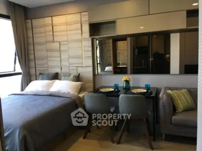 Modern studio apartment with stylish decor and cozy dining area